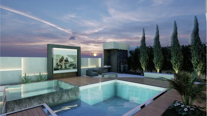 Piscina iluminada à noite, com parede de pedra e ciprestes
